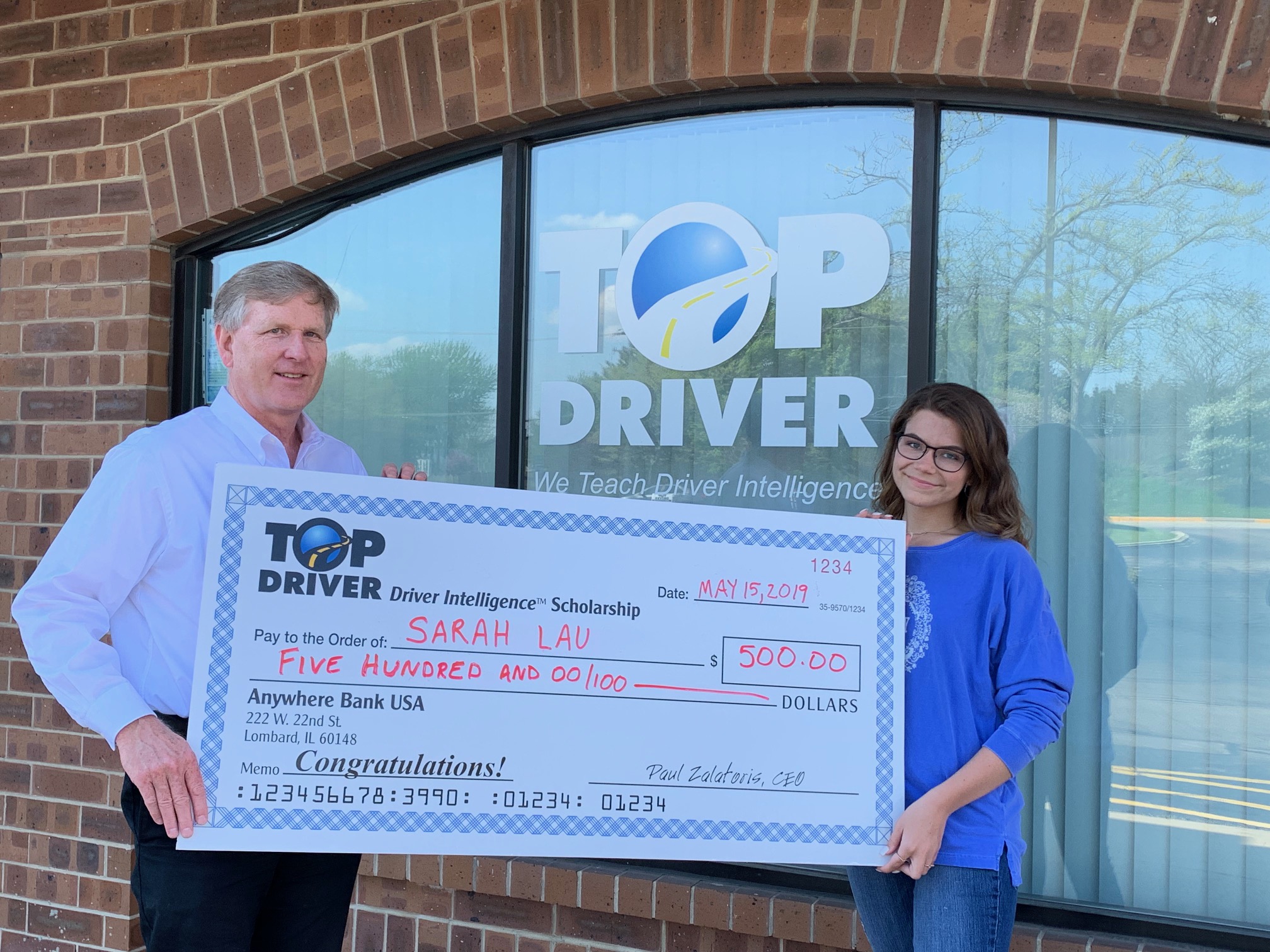 Sarah Lau $500 check from Top Driver
